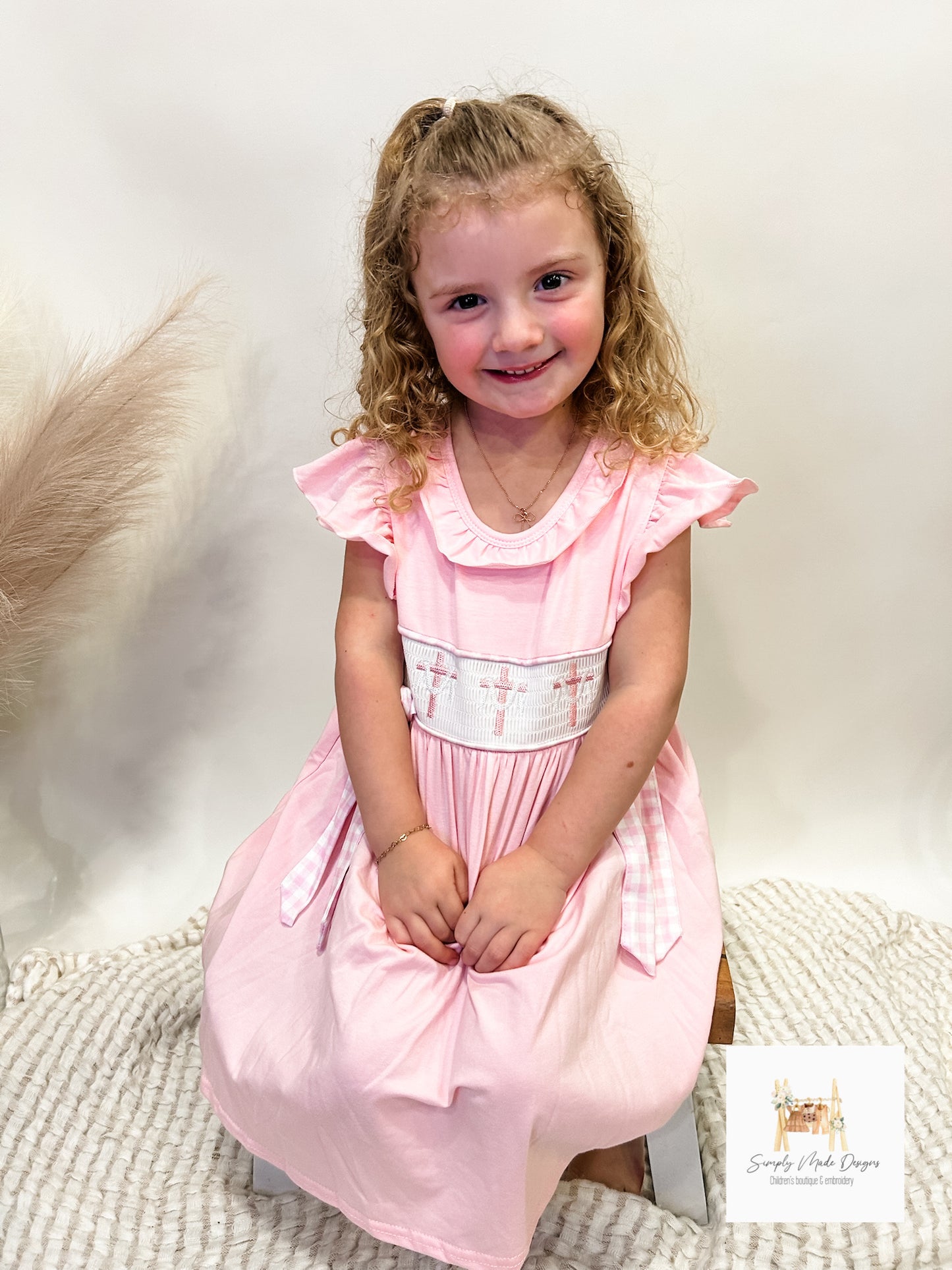 Pink cross smocked girls dress
