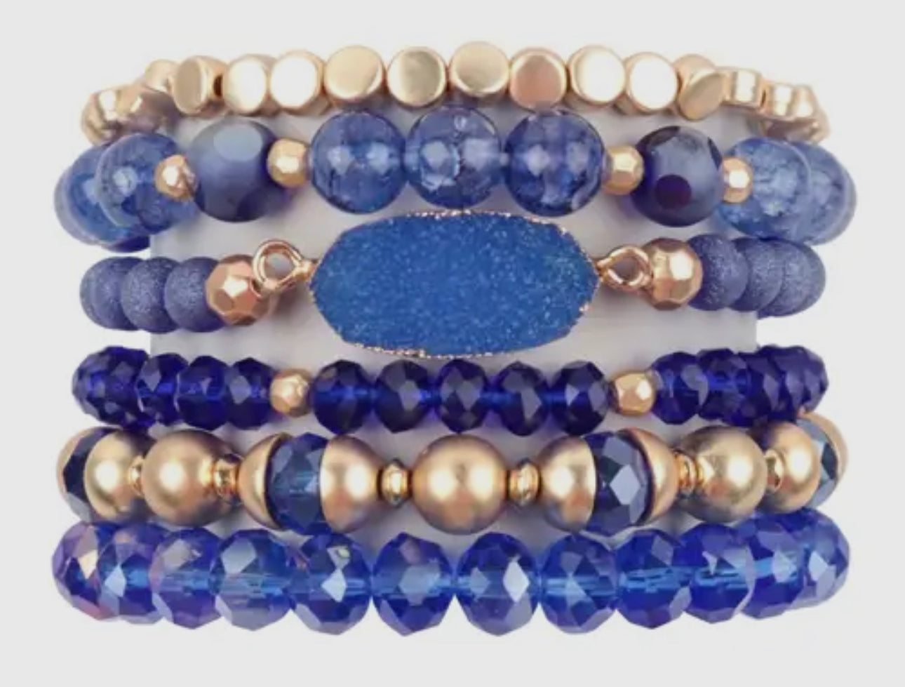 Blue charm bracelet stack