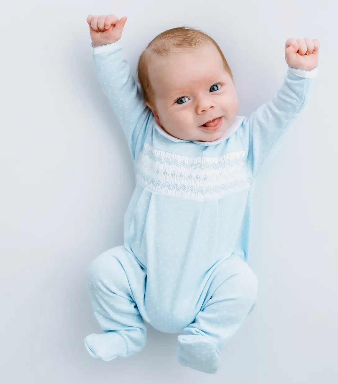 Luca’s classic dot smocked footie