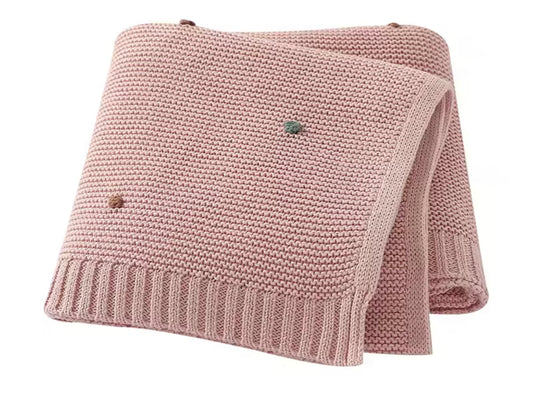 Pink polka dot knit blanket