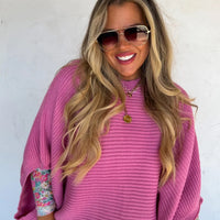 Pink sweater poncho