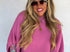 Pink sweater poncho
