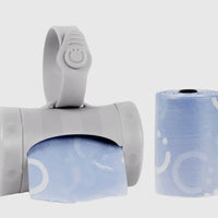 Grey Ubbi on the go bag dispenser with bags