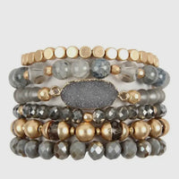 Grey charm bracelet stack