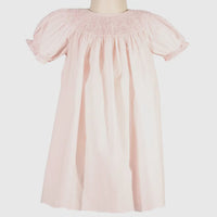 Light pink smocked pearl bishop dress